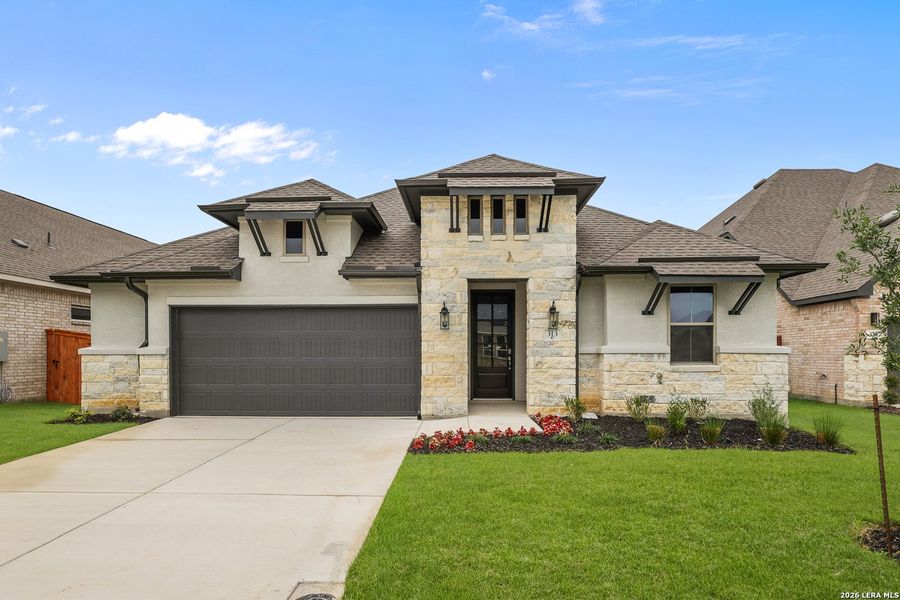 Front exterior of a new home in Megan's Landing, Castroville, TX, highlighting curb appeal (Image 22).
