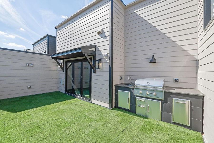Exterior details and patio area of a home in Skyview On Broad, Sugar Hill (Image 2).