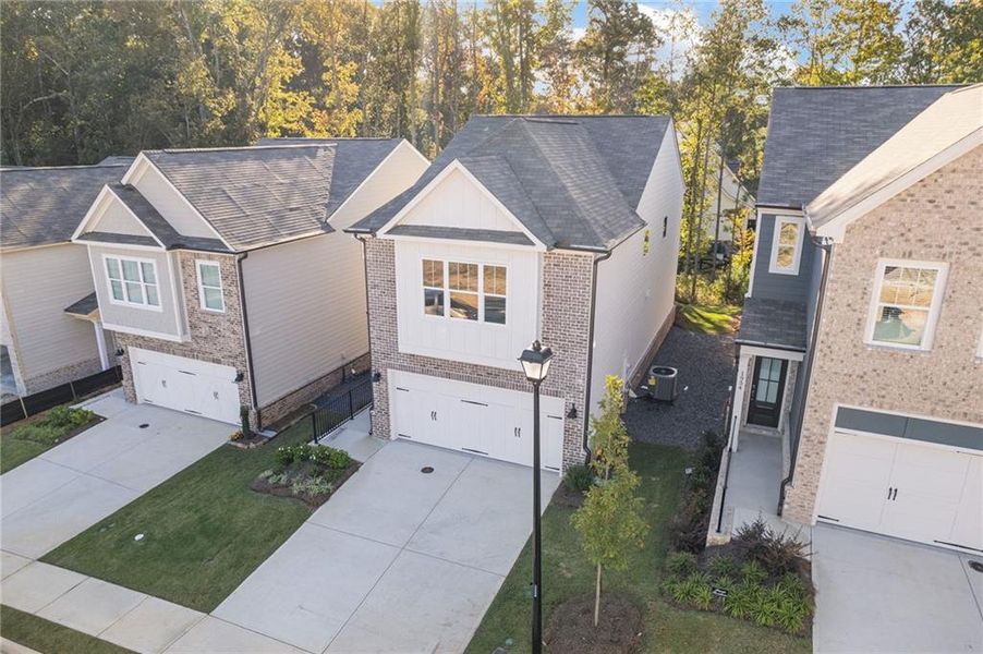 Front exterior of a new home in , Dacula, GA, highlighting curb appeal (Image 1).