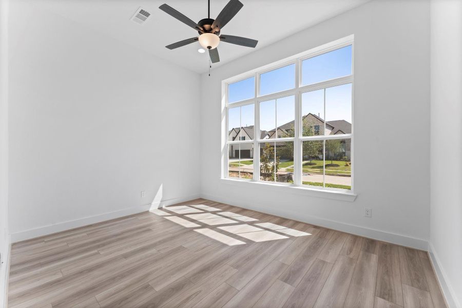 Study/ Home Office with Natural Light, LVP Flooring, and Fan