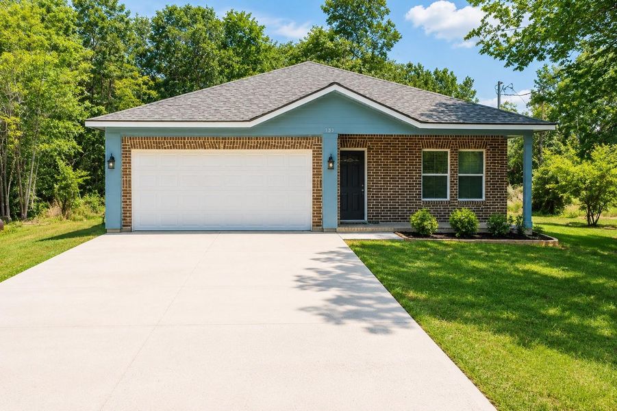 Front exterior of a new home in , Hempstead, TX, highlighting curb appeal (Image 1). Front exterior of a new home in , Hempstead, TX, highlighting curb appeal (Image 1).