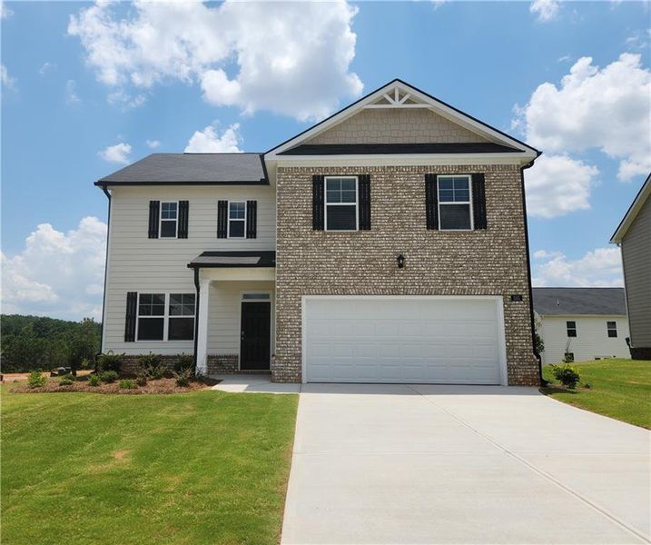 Front exterior of a new home in Locust Grove Station - Cedar Ridge, Locust Grove, GA, highlighting curb appeal (Image 1).