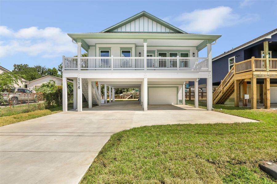 Charming elevated home with a spacious balcony, offering 4 bedrooms and 2 baths, perfect for comfortable bay living.