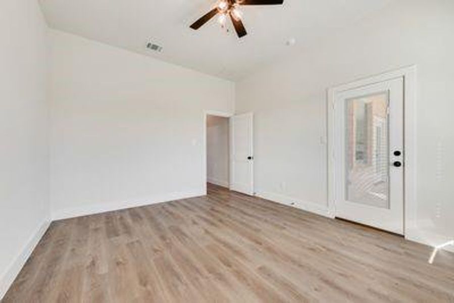 Spare room featuring ceiling fan and light hardwood / wood-style flooring