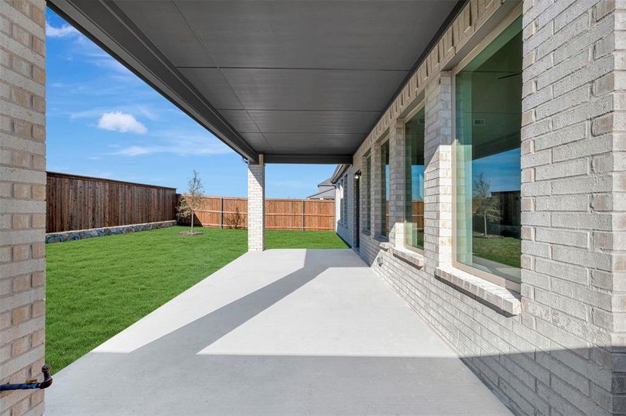 Exterior details and patio area of a home in Lily Creek at Sutton Fields, Aubrey (Image 3).