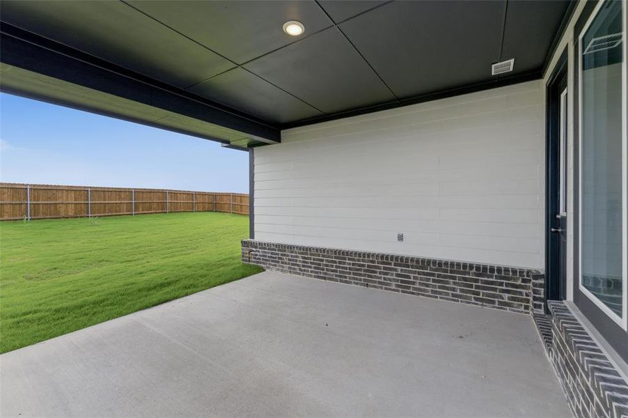 Covered patio with recessed lighting and concrete flooring