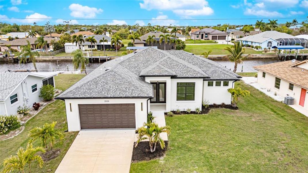 Front exterior of a new home in , Port Charlotte, FL, highlighting curb appeal (Image 18). Front exterior of a new home in , Port Charlotte, FL, highlighting curb appeal (Image 18).