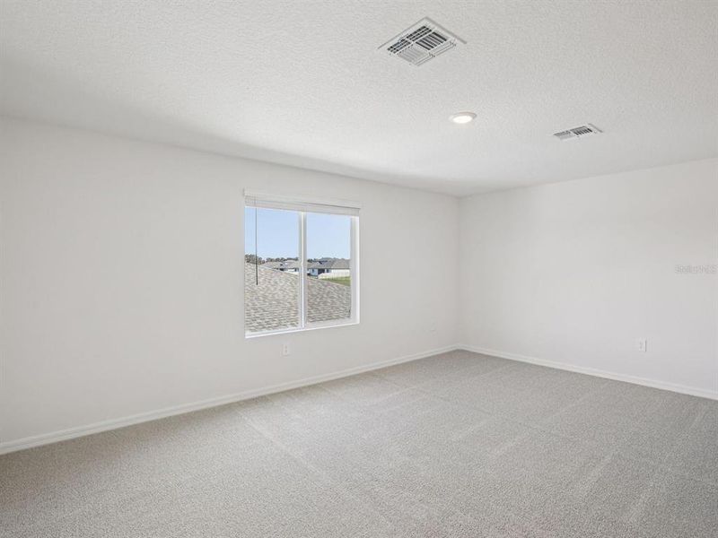 Spacious, unfurnished interior of a new home in The Grove at Stuart Crossing - Classic Series, Bartow (Image 32).