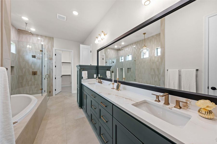 A refined primary bathroom, showcasing a soaking tub and an elegant glass-enclosed shower. A refined primary bathroom, showcasing a soaking tub and an elegant glass-enclosed shower.
