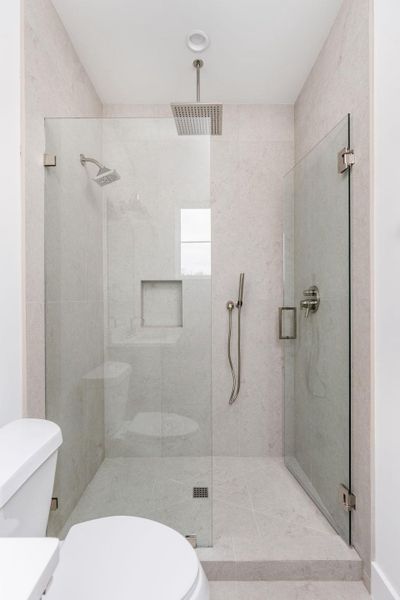 Bathroom featuring a shower stall and vanity