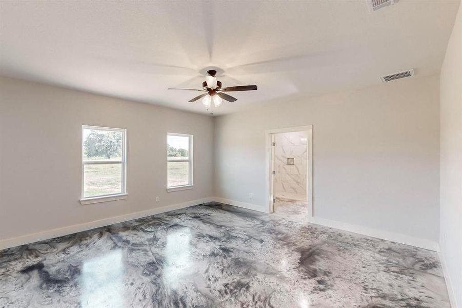 Unfurnished room featuring ceiling fan