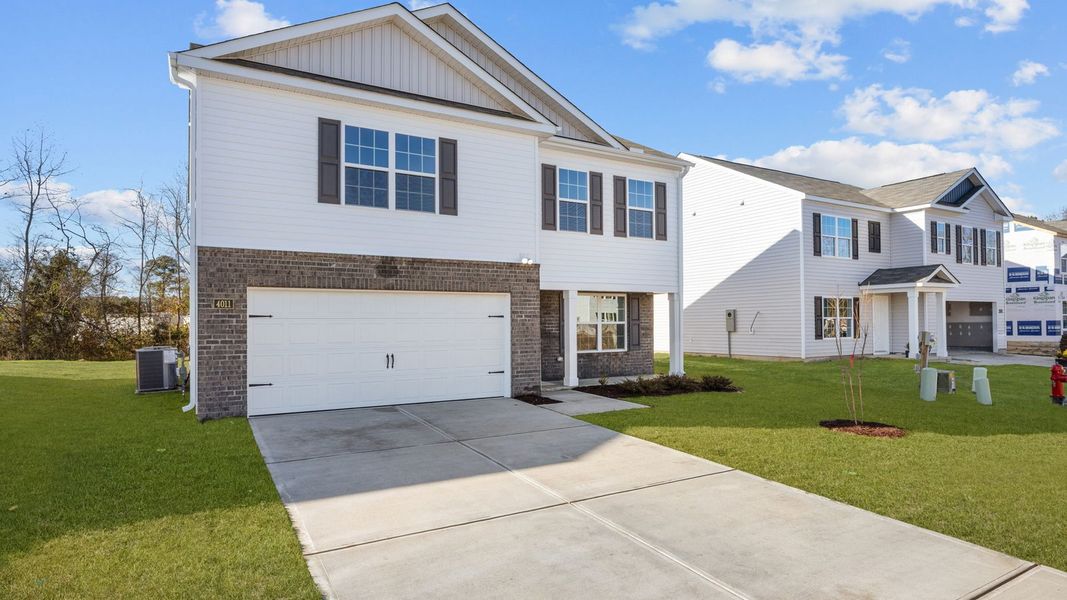 Front exterior of a new home in Madeline Farm, New Bern, NC, highlighting curb appeal (Image 22).