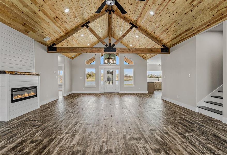 Open living with cedar ceilings, gable. Electric Fireplace. LVP Floors throughout home.
