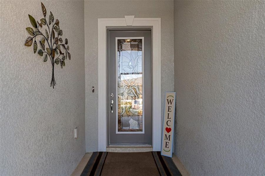 upgraded stained glass door, screened in front entrance