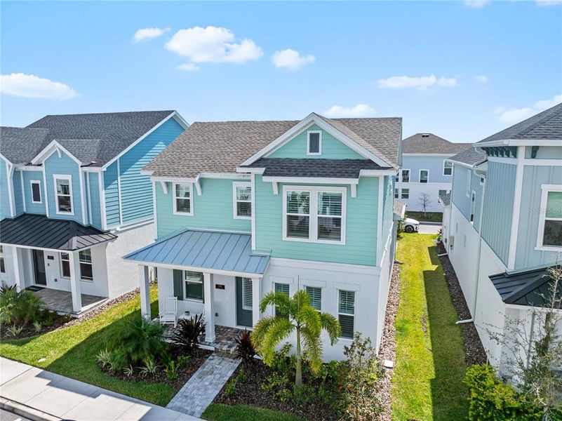 Front exterior of a new home in Emerald Landing at Waterside at Lakewood Ranch – Cottage Series, Sarasota, FL, highlighting curb appeal (Image 25). Front exterior of a new home in Emerald Landing at Waterside at Lakewood Ranch – Cottage Series, Sarasota, FL, highlighting curb appeal (Image 25).