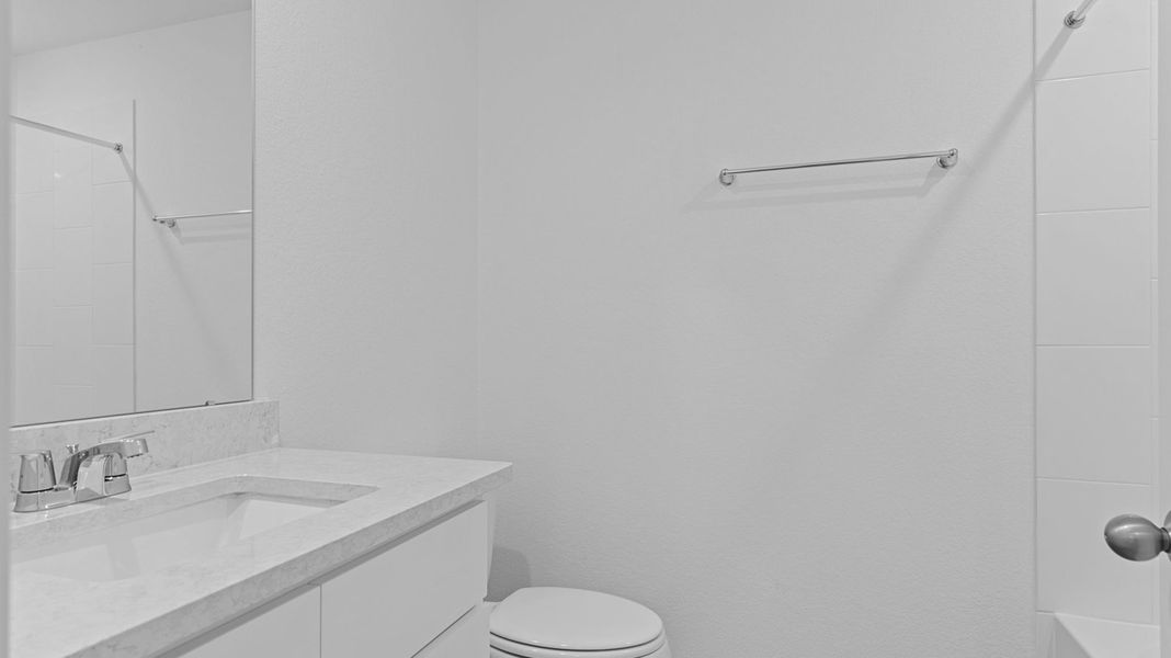 Furnished interior view inside a new home in Caldwell Crossing, Iowa Colony (Image 8).