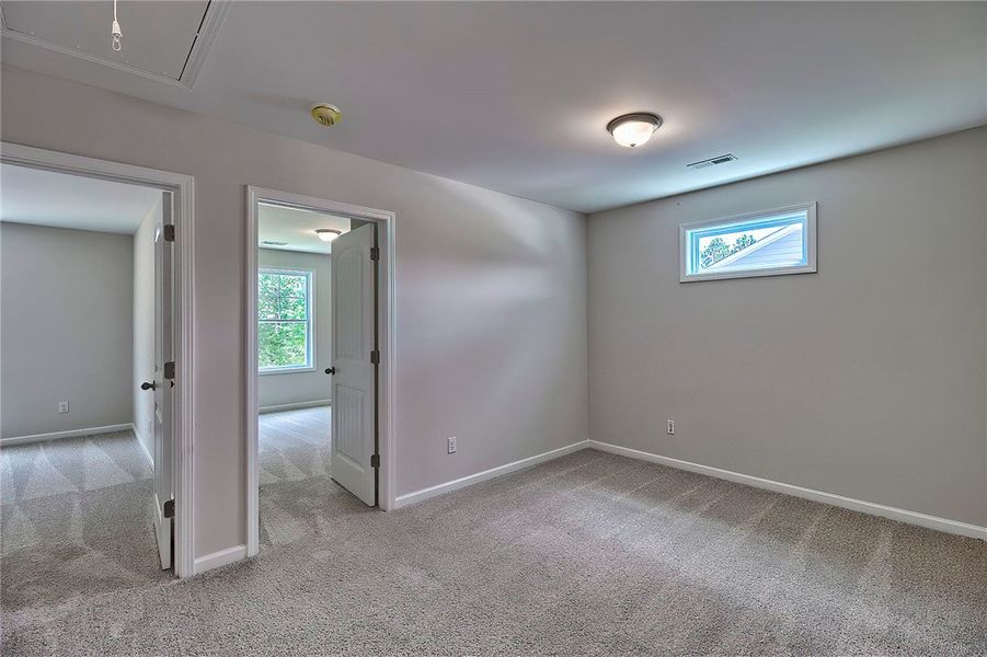 This spacious room offers comfort and versatility,