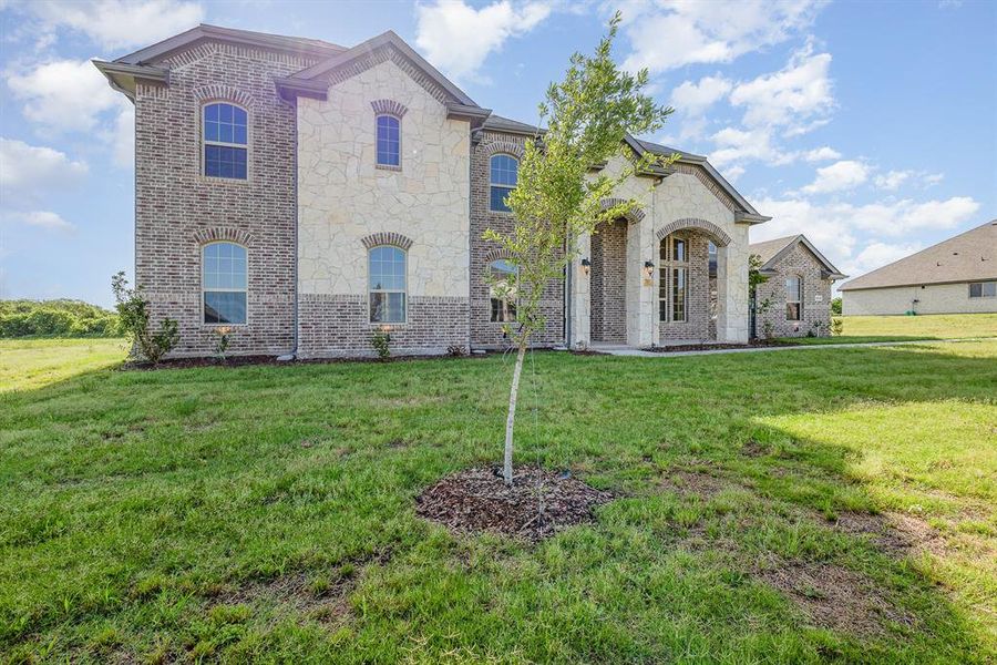 Front exterior of a new home in , Waxahachie, TX, highlighting curb appeal (Image 18).
