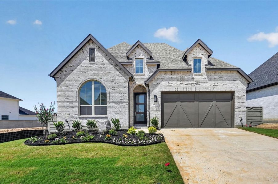 Front exterior of a new home in Landmark, Denton, TX, highlighting curb appeal (Image 1). Front exterior of a new home in Landmark, Denton, TX, highlighting curb appeal (Image 1).