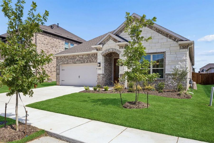 Front exterior of a new home in Country Lakes, Denton, TX, highlighting curb appeal (Image 1). Front exterior of a new home in Country Lakes, Denton, TX, highlighting curb appeal (Image 1).