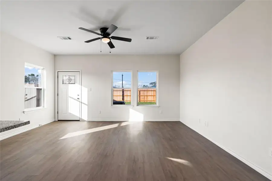 This spacious living room provides a comfortable, open setting perfect for hosting, unwinding, or everyday moments.