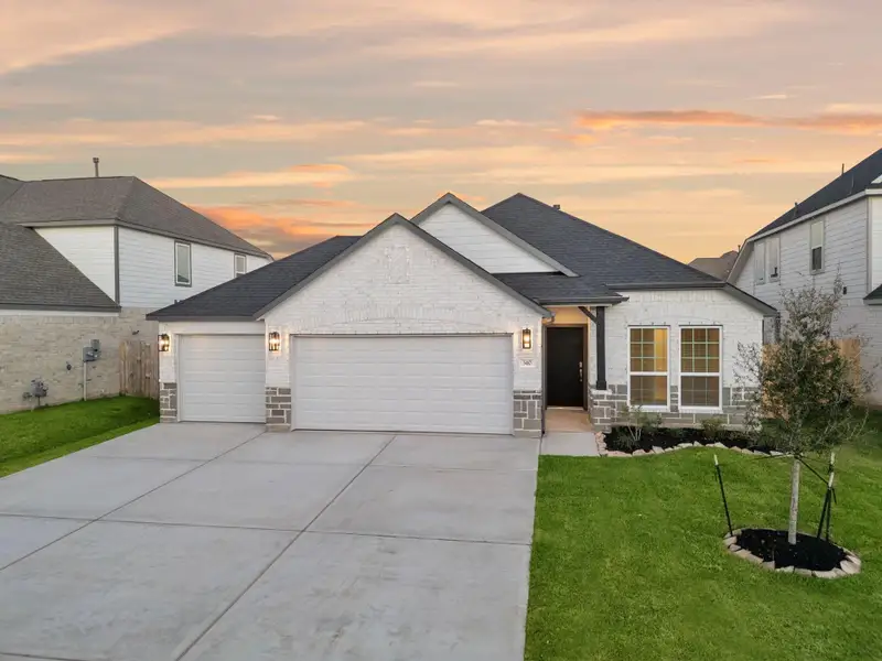 Front exterior of a new home in Beacon Hill, Waller, TX, highlighting curb appeal (Image 2). Front exterior of a new home in Beacon Hill, Waller, TX, highlighting curb appeal (Image 2).