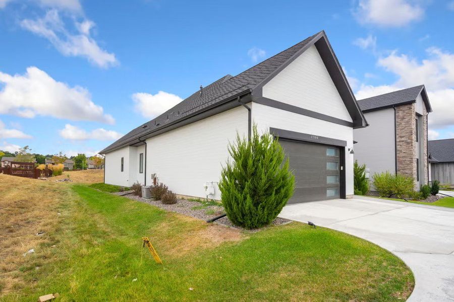 Front exterior of a new home in Pelican Shores at Water Valley, Windsor, CO, highlighting curb appeal (Image 19). Front exterior of a new home in Pelican Shores at Water Valley, Windsor, CO, highlighting curb appeal (Image 19).