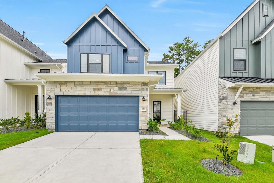 Front exterior of a new home in Summer Place  35', Montgomery, TX, highlighting curb appeal (Image 28).