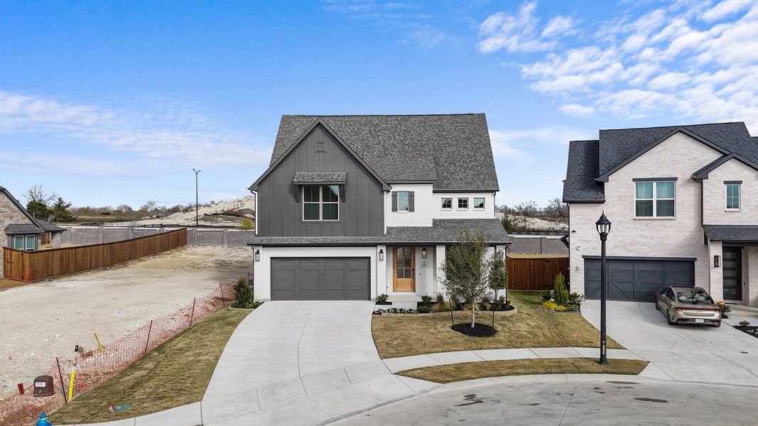 Front exterior of a new home in Aster Park, McKinney, TX, highlighting curb appeal (Image 2). Front exterior of a new home in Aster Park, McKinney, TX, highlighting curb appeal (Image 2).