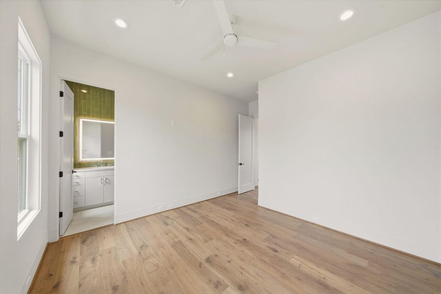 One of the three secondary bedrooms. All bedrooms offer en suite bathroom and walk-in closet.
