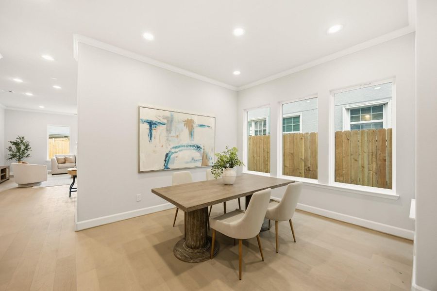 Dine under the soft embrace of daylight, with a wall of windows inviting the outside in. Dine under the soft embrace of daylight, with a wall of windows inviting the outside in.