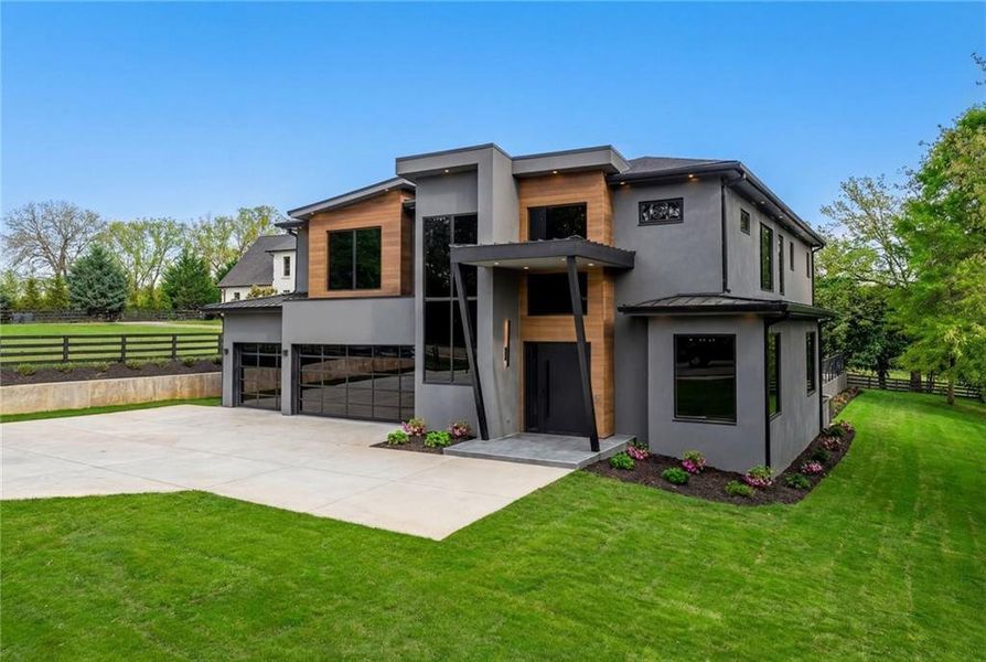 Front exterior of a new home in , Sugar Hill, GA, highlighting curb appeal (Image 1). Front exterior of a new home in , Sugar Hill, GA, highlighting curb appeal (Image 1).