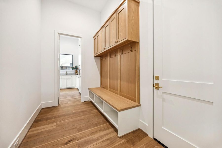 Mudroom creates an organized transition from garage to home with built in cabinetry, hooks, and bench seating. Thoughtful storage keeps everyday items tucked away while maintaining a clean, streamlined entry point.**Previous build by Arch Angelo** Mudroom creates an organized transition from garage to home with built in cabinetry, hooks, and bench seating. Thoughtful storage keeps everyday items tucked away while maintaining a clean, streamlined entry point.**Previous build by Arch Angelo**