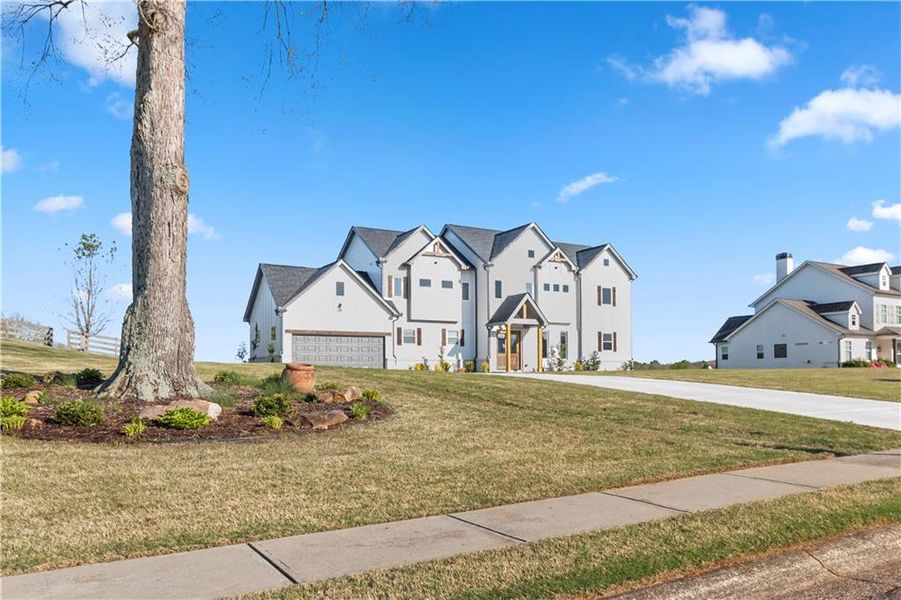 Front exterior of a new home in , Clermont, GA, highlighting curb appeal (Image 25). Front exterior of a new home in , Clermont, GA, highlighting curb appeal (Image 25).