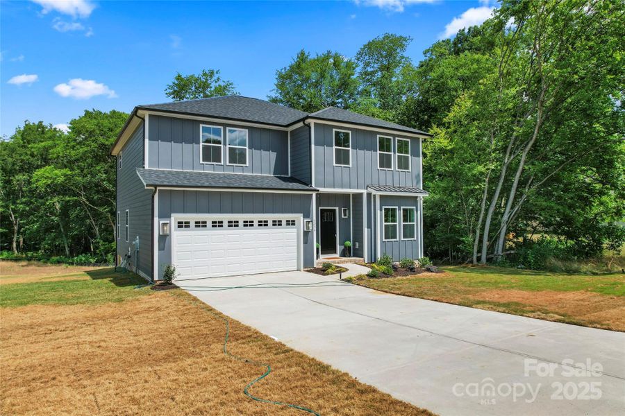 Front exterior of a new home in , Harrisburg, NC, highlighting curb appeal (Image 2).
