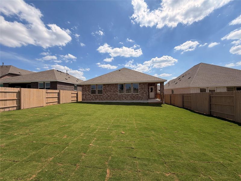 Exterior details and patio area of a home in The Colony, Bastrop (Image 3).