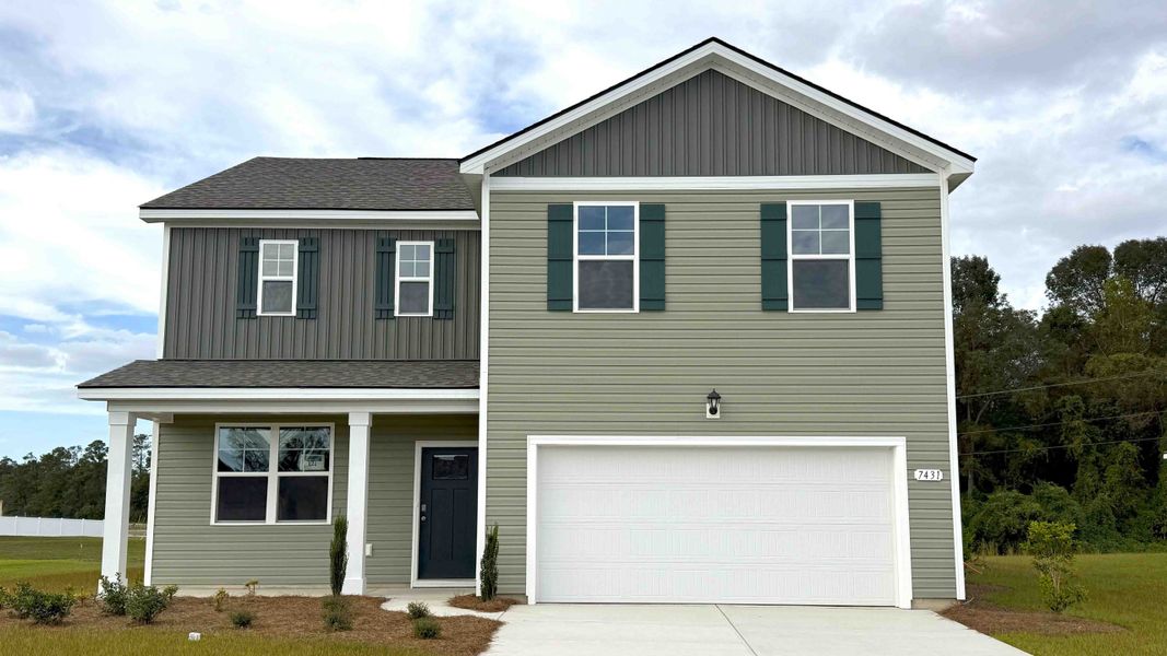 Front exterior of a new home in Meadow Walk, Loris, SC, highlighting curb appeal (Image 1).