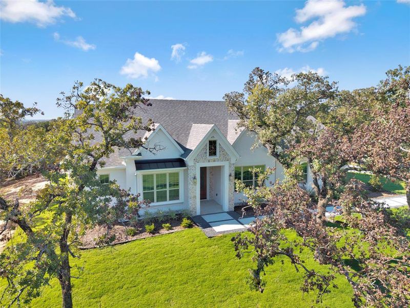 Front exterior of a new home in , Azle, TX, highlighting curb appeal (Image 23). Front exterior of a new home in , Azle, TX, highlighting curb appeal (Image 23).