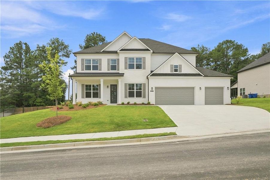 Front exterior of a new home in The Stables at Ewing Chapel, Dacula, GA, highlighting curb appeal (Image 26).