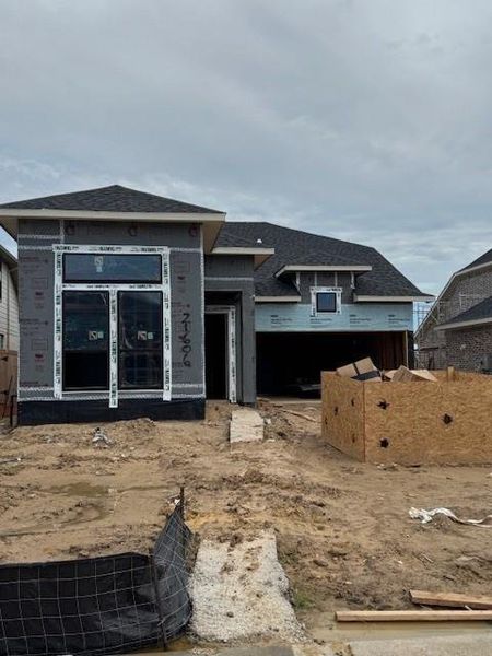 Front exterior of a new home in Bridgeland 45', 50', 70', Cypress, TX, highlighting curb appeal (Image 1). Front exterior of a new home in Bridgeland 45', 50', 70', Cypress, TX, highlighting curb appeal (Image 1).