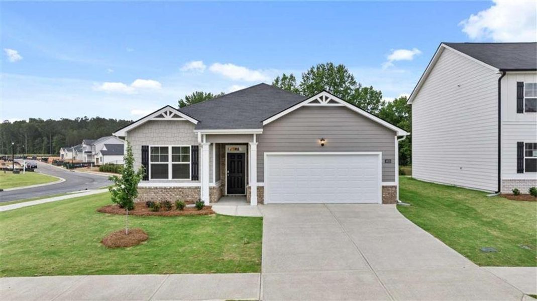 Front exterior of a new home in Cottages at Blue Ridge, Bonaire, GA, highlighting curb appeal (Image 1). Front exterior of a new home in Cottages at Blue Ridge, Bonaire, GA, highlighting curb appeal (Image 1).