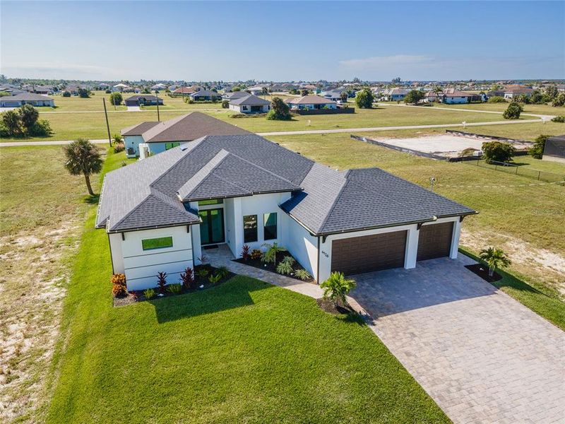 Front exterior of a new home in , Cape Coral, FL, highlighting curb appeal (Image 28). Front exterior of a new home in , Cape Coral, FL, highlighting curb appeal (Image 28).
