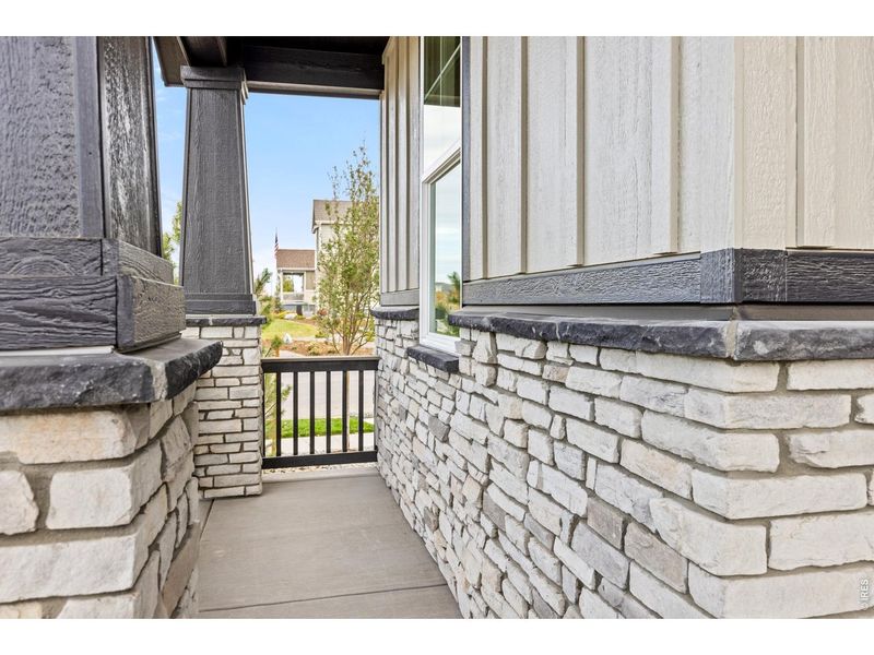 Exterior details and patio area of a home in Barefoot Lakes, Firestone (Image 20).