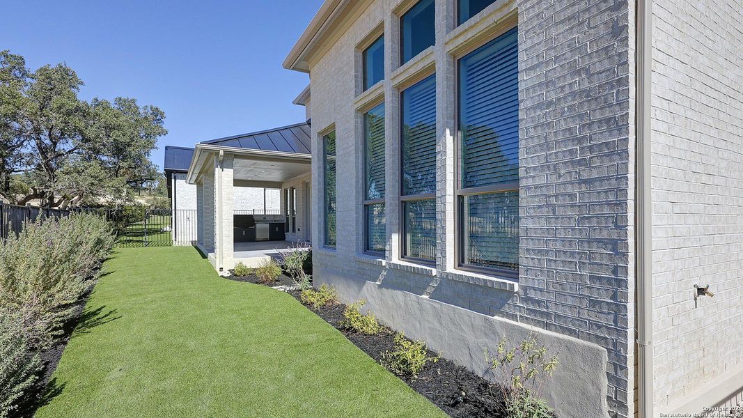 Exterior details and patio area of a home in The Dominion 70', San Antonio (Image 3). Exterior details and patio area of a home in The Dominion 70', San Antonio (Image 3).
