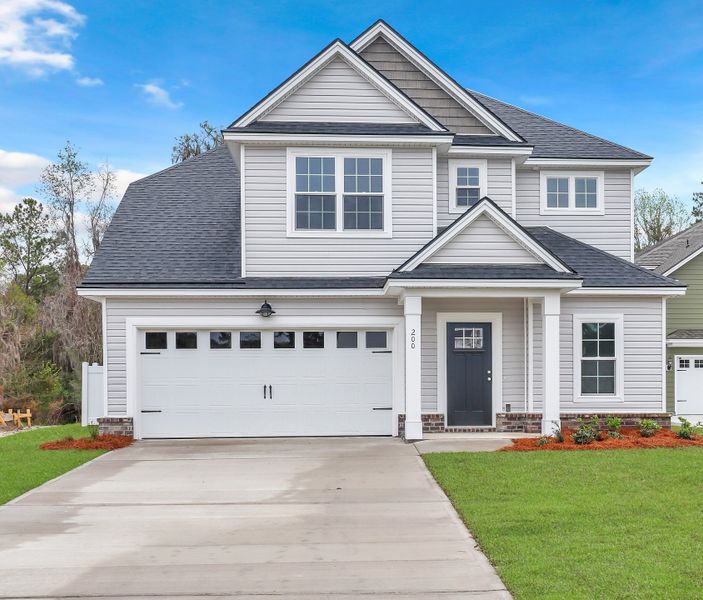 Representative exterior photo of a completed home built from the Sherwood by Ernest Homes in Wexford, Richmond Hill, GA (Image 1).