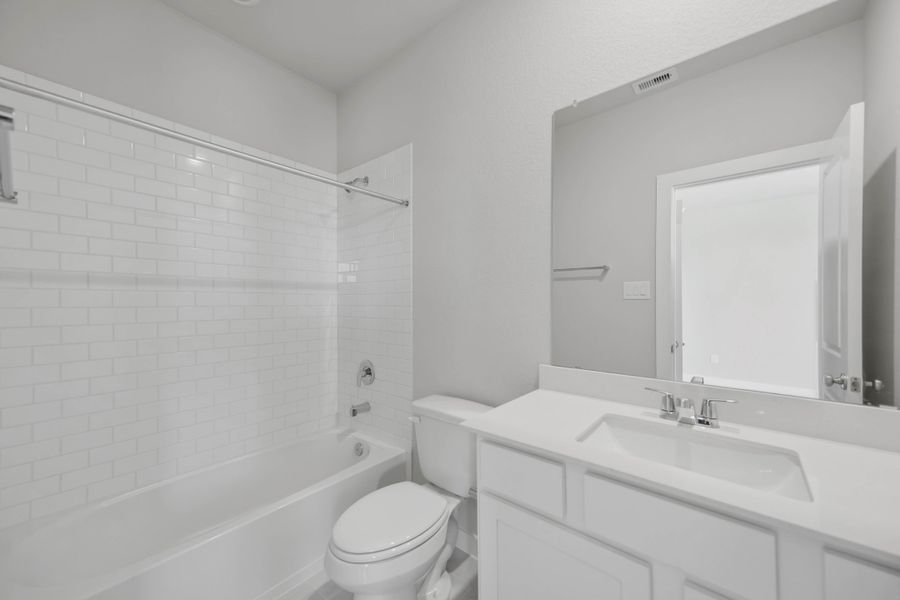 Furnished interior view inside a new home in Sunterra 40, Katy (Image 14).