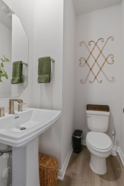 Bathroom featuring toilet and light wood-style flooring