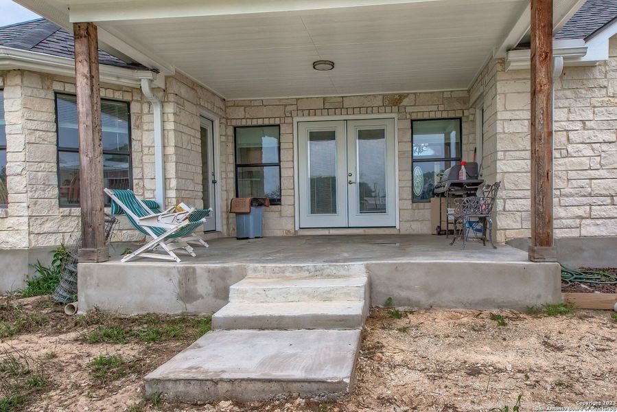 Front exterior of a new home in , La Vernia, TX, highlighting curb appeal (Image 19).