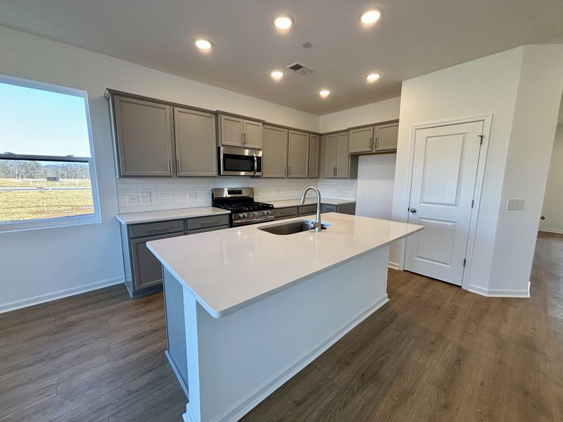 Furnished interior view inside a new home in Nexus Townhomes, Gallatin (Image 6).