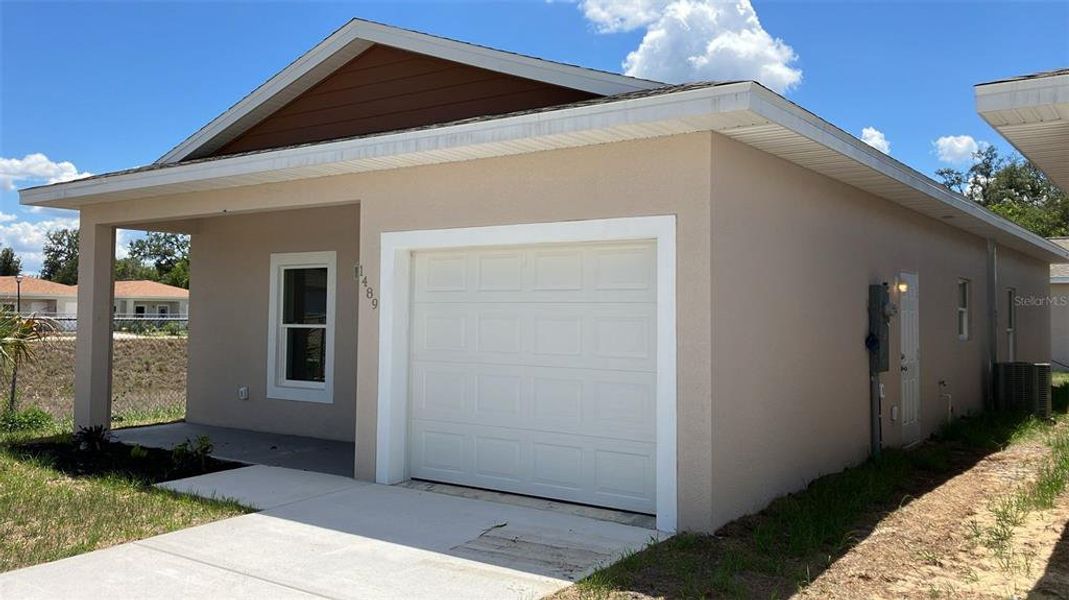 Front exterior of a new home in , Sebring, FL, highlighting curb appeal (Image 27).
